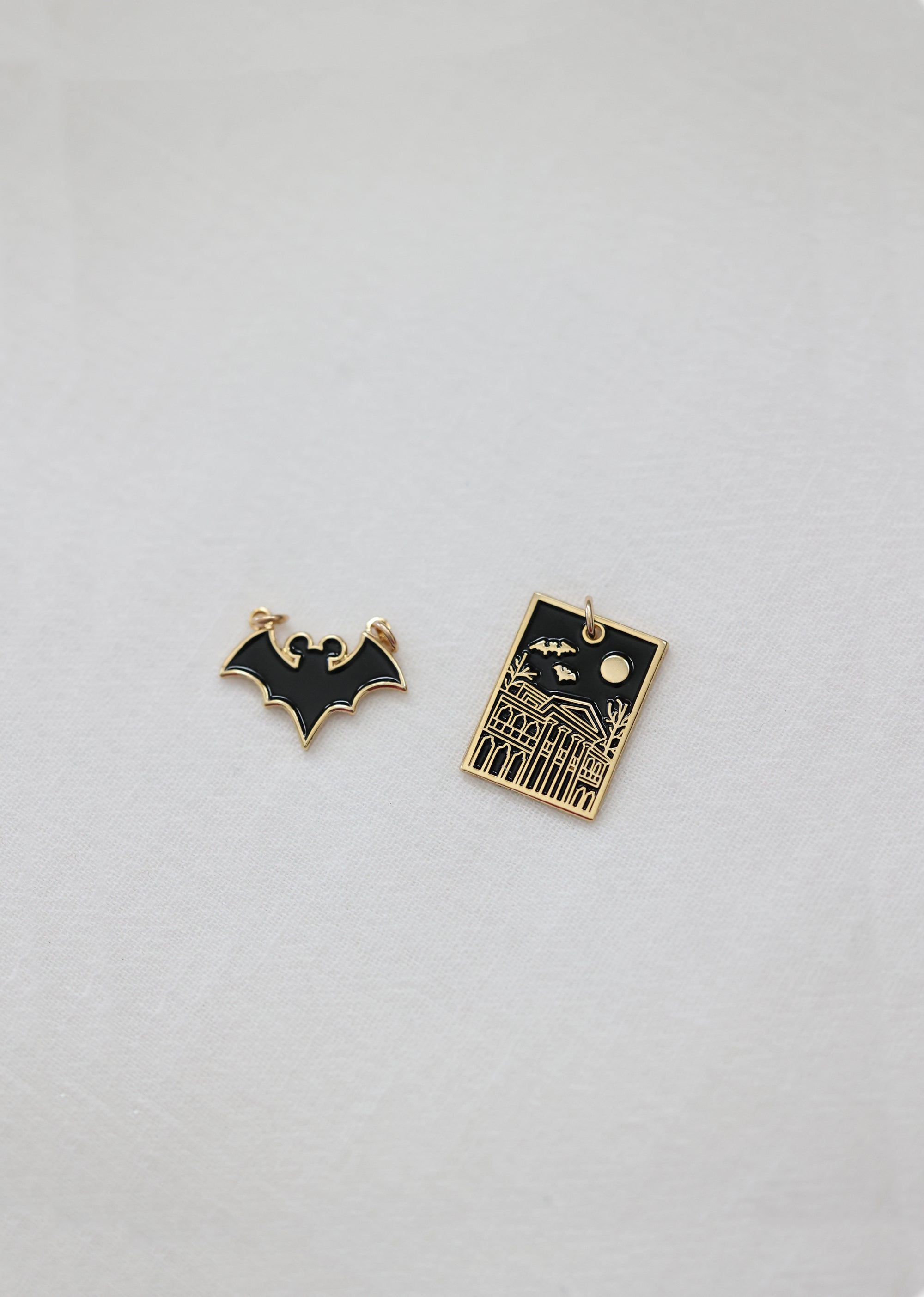 DC Comics Batman Gold & Black Heart Batman Logo Earrings | Hot Topic